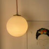 Hanging pendant light with warm glow.